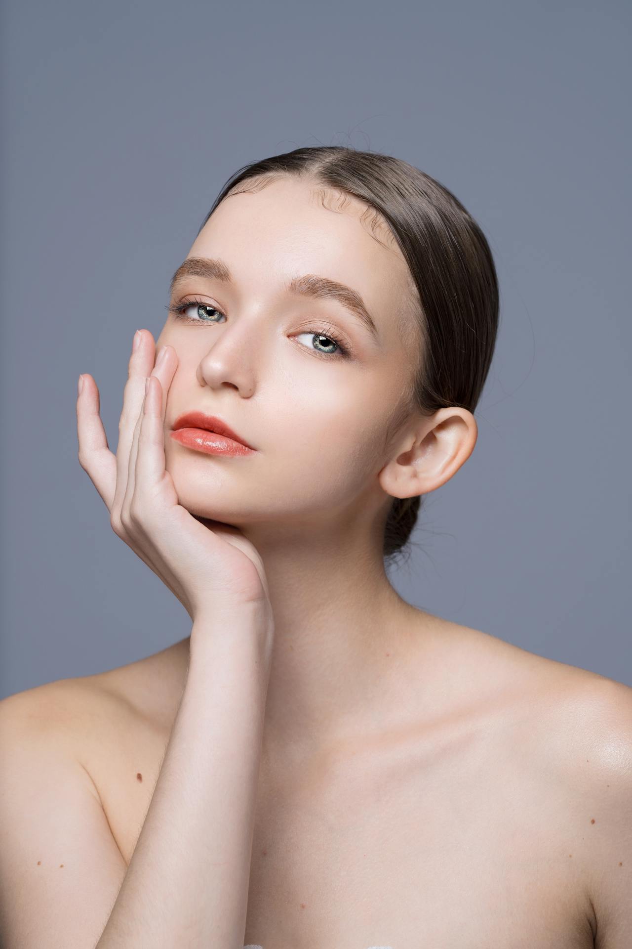 Elegant Portrait of a Young Woman with Clean Makeup