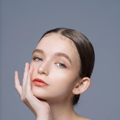 Elegant Portrait of a Young Woman with Clean Makeup
