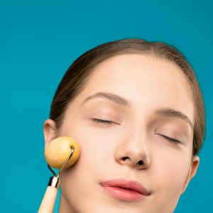 Woman Using Facial Roller