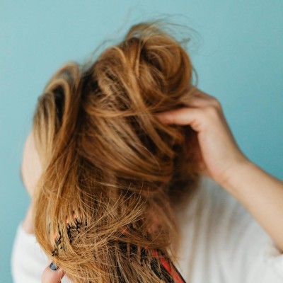 A Woman Brushing her Hair
