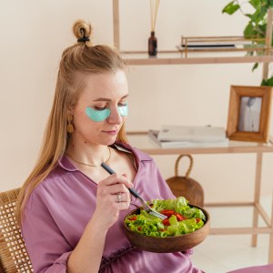 Woman Eating Vegetable Salad