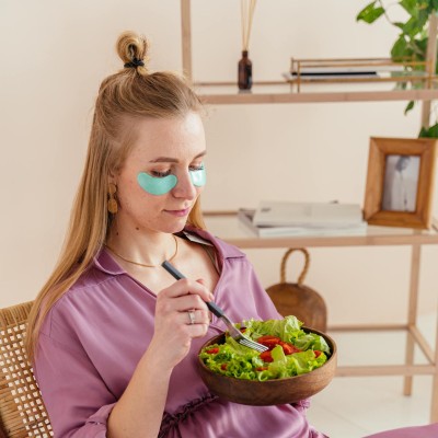 Woman Eating Vegetable Salad
