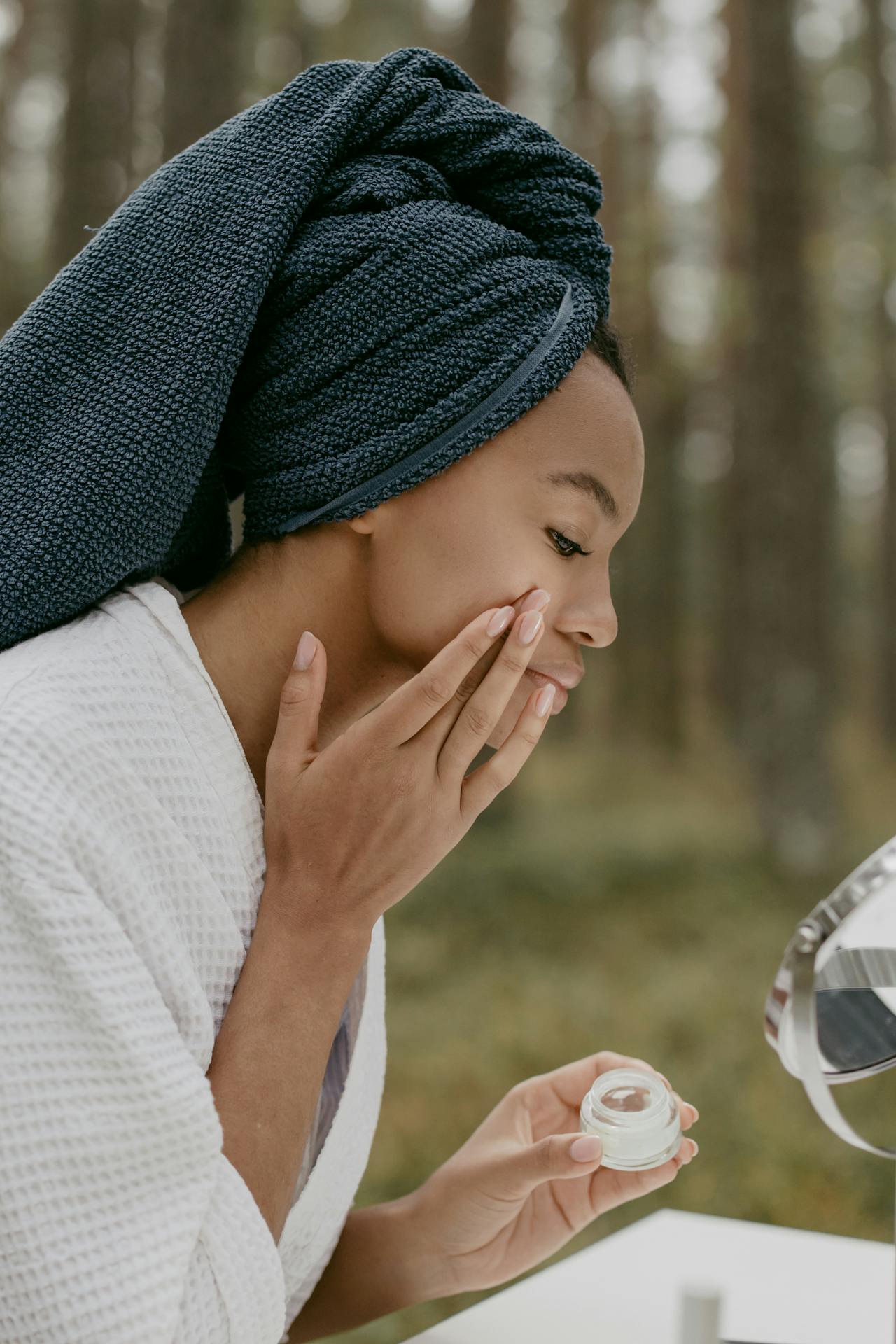 woman applying skin care products