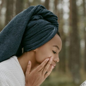 woman applying skin care products