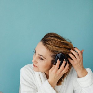 Woman checking her scalp