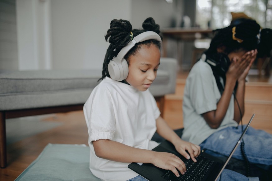 black kid using laptop
