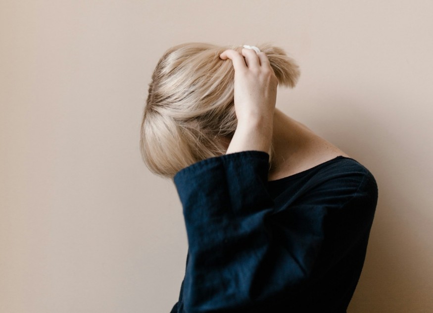 girl covering her face