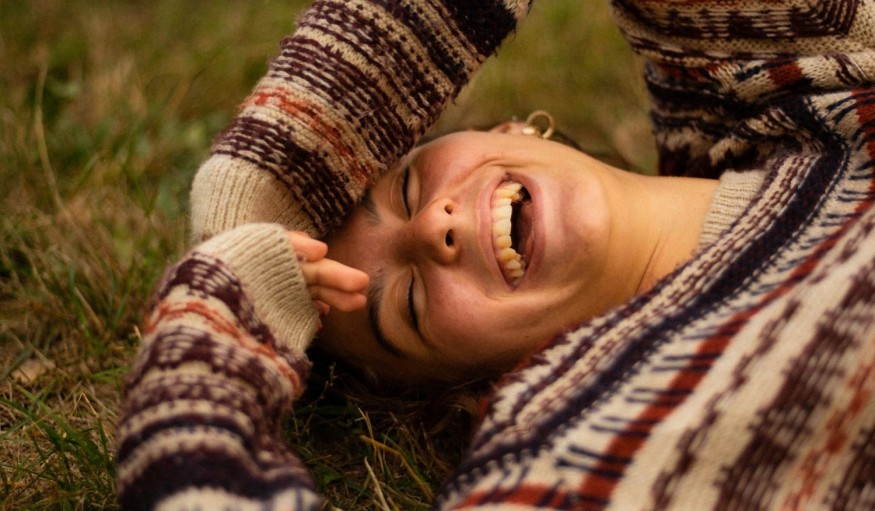 girl in sweater smiling