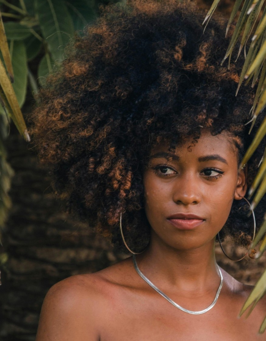 black woman with warm balayage