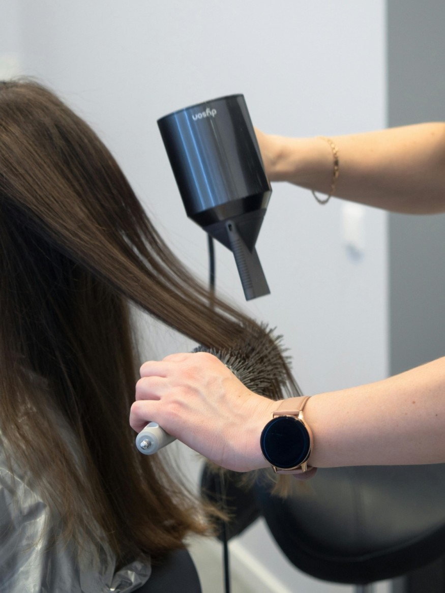 Woman getting hair done