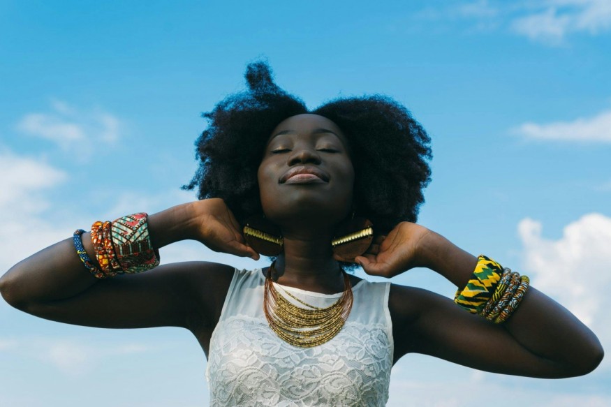 Black model with eyes closed