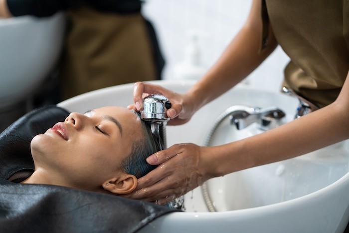 Woma getting hair wash