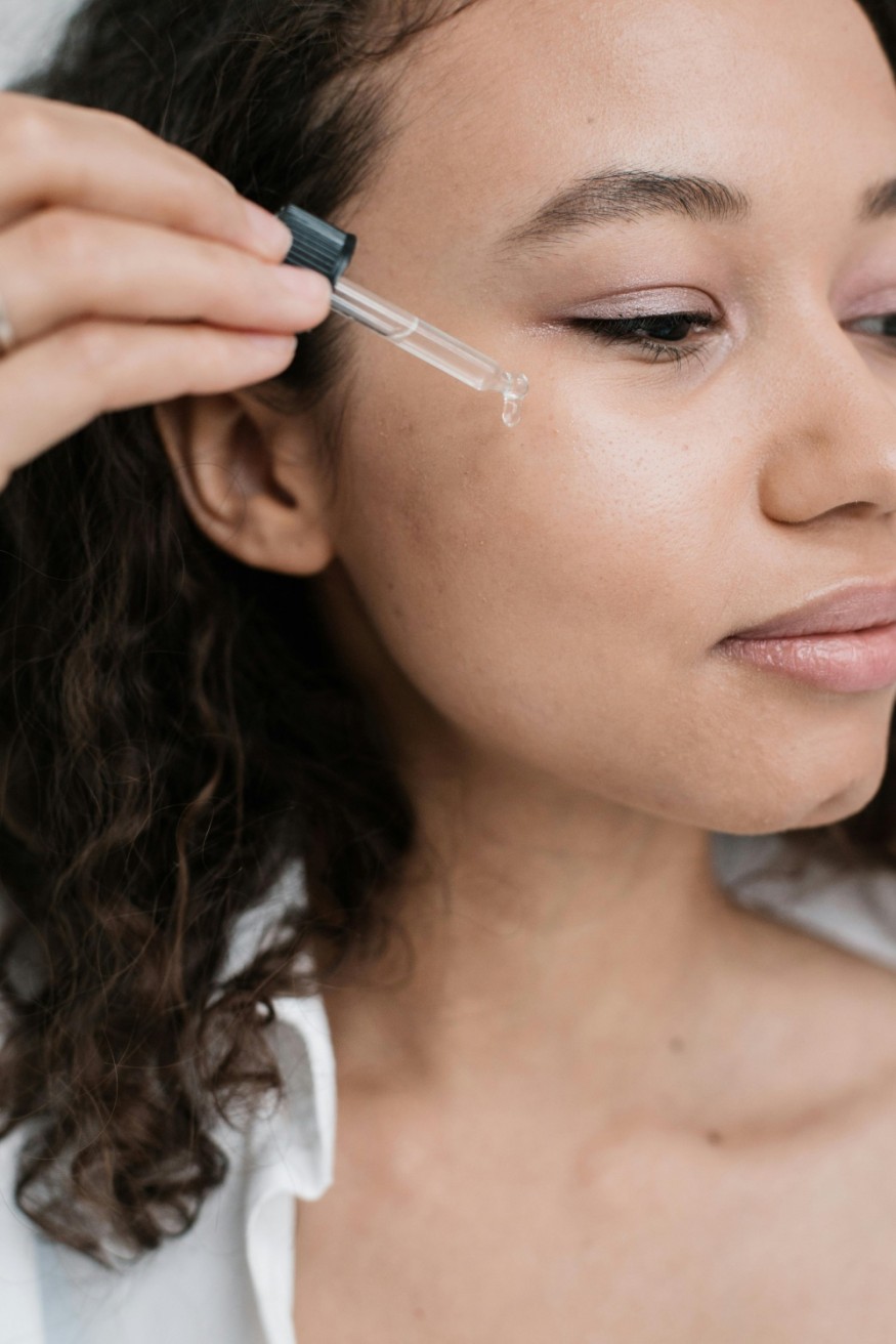 woman applying face oil