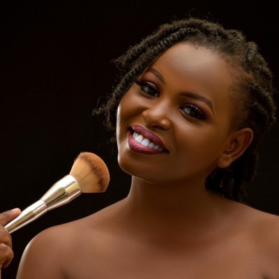 Woman putting on makeup, foundation